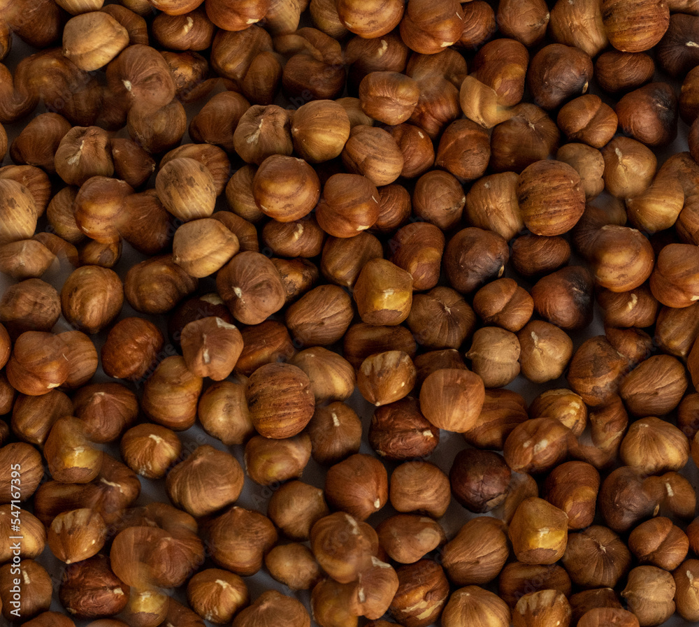 Culinary background with round peeled nuts. Hazelnut photographed from above. Culinary background with round peeled nuts. Hazelnut photographed from above.