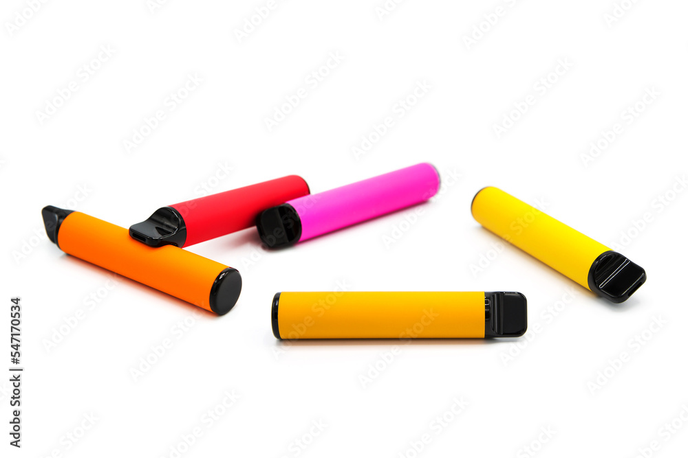 Set of colorful disposable electronic cigarettes isolated on white background. The concept of modern smoking, vaping and nicotine. Set of colorful disposable electronic cigarettes isolated on white background. The concept of modern smoking, vaping and nicotine.