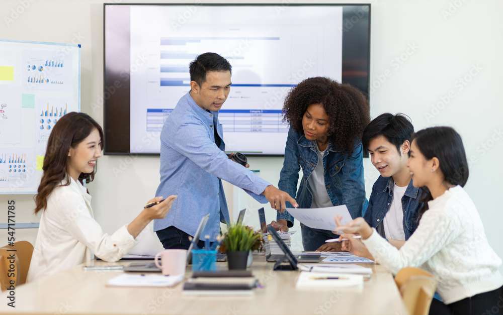 Young people meeting to discuss successful business projects in the office. Human relations and working with colleagues in the organization happily.