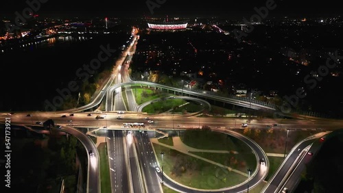 Aerial night view of empty highway and interchange Warsaw Europe after epidemic lockdown. Cityscapes with disappearing traffic on streets. Roads and lanes crossroads photo