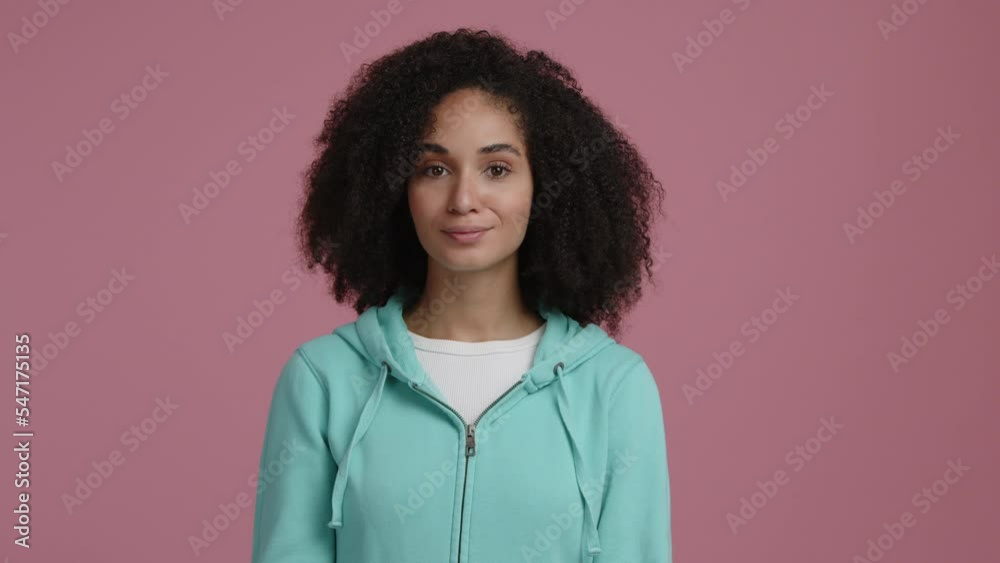 Portrait of a serious, mixed race woman makes a silence gesture. Attractive lady shows that she can keep a secret. High quality 4k footage Portrait of a serious, mixed race woman makes a silence gesture. Attractive lady shows that she can keep a secret. High quality 4k footage