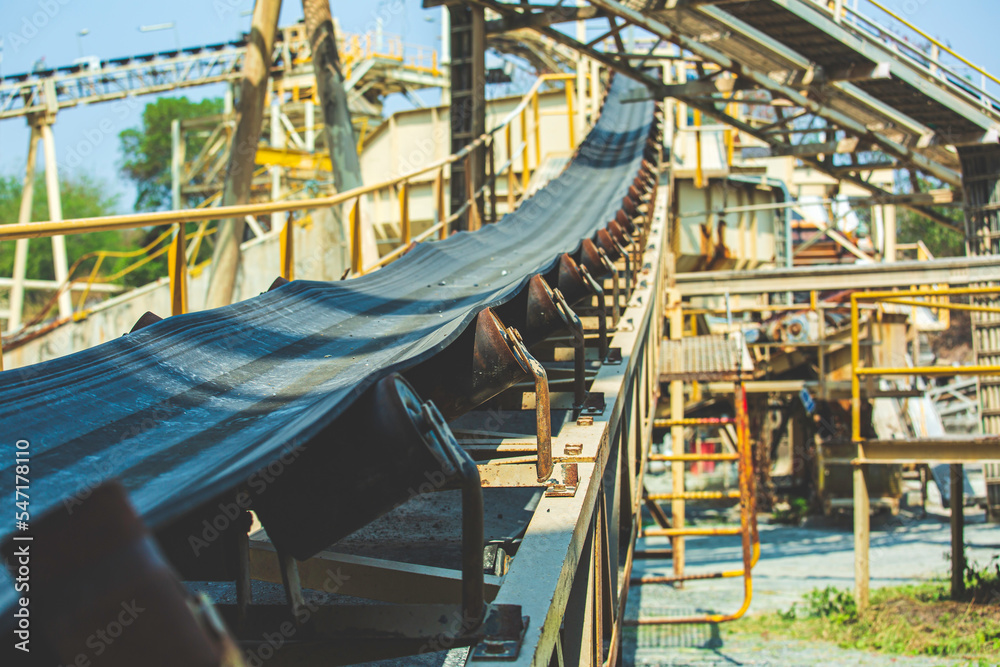 Industrial belt conveyor moving raw materials from mine