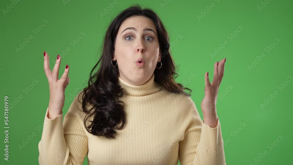 Portrait of amazed pretty young woman 20s shocked, saying WOW. Attractive female surprised isolated on solid green screen background. Portrait of amazed pretty young woman 20s shocked, saying WOW. Attractive female surprised isolated on solid green screen background.