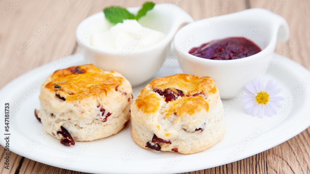 Cranberry scone set with raspberry jam and clotted cream