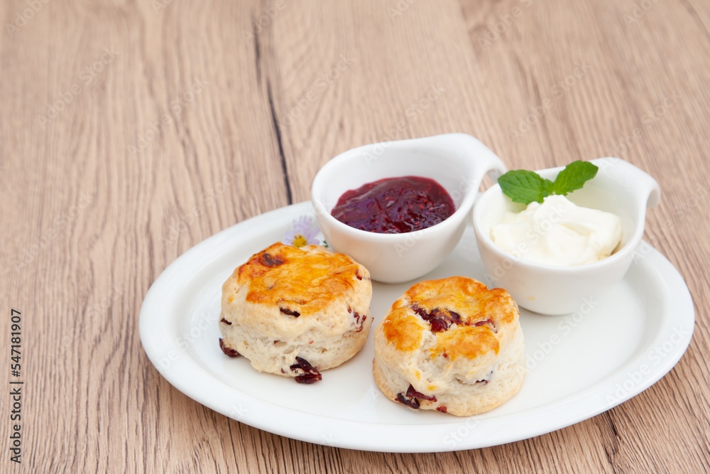 Cranberry scone set with raspberry jam and clotted cream