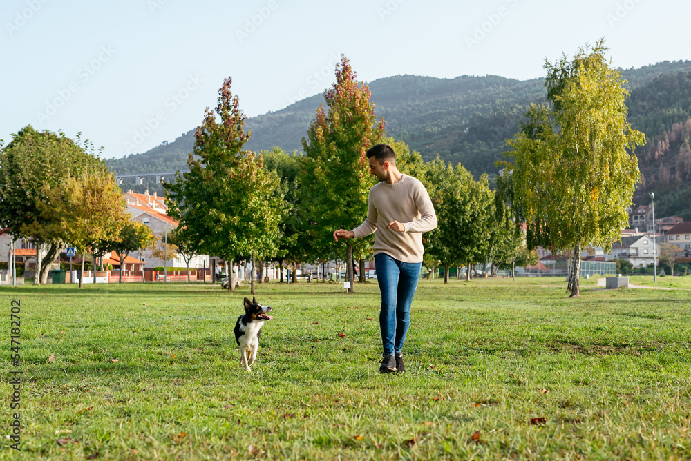 Man spending time with dog in countryside Man spending time with dog in countryside