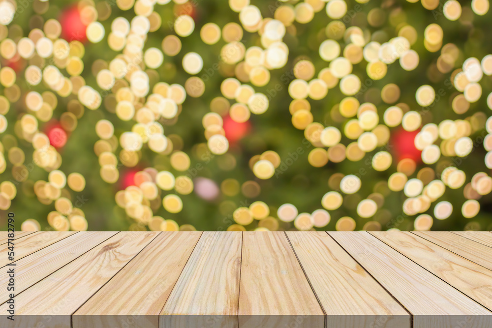 Empty wood table top with blur Christmas tree with bokeh light background Empty wood table top with blur Christmas tree with bokeh light background
