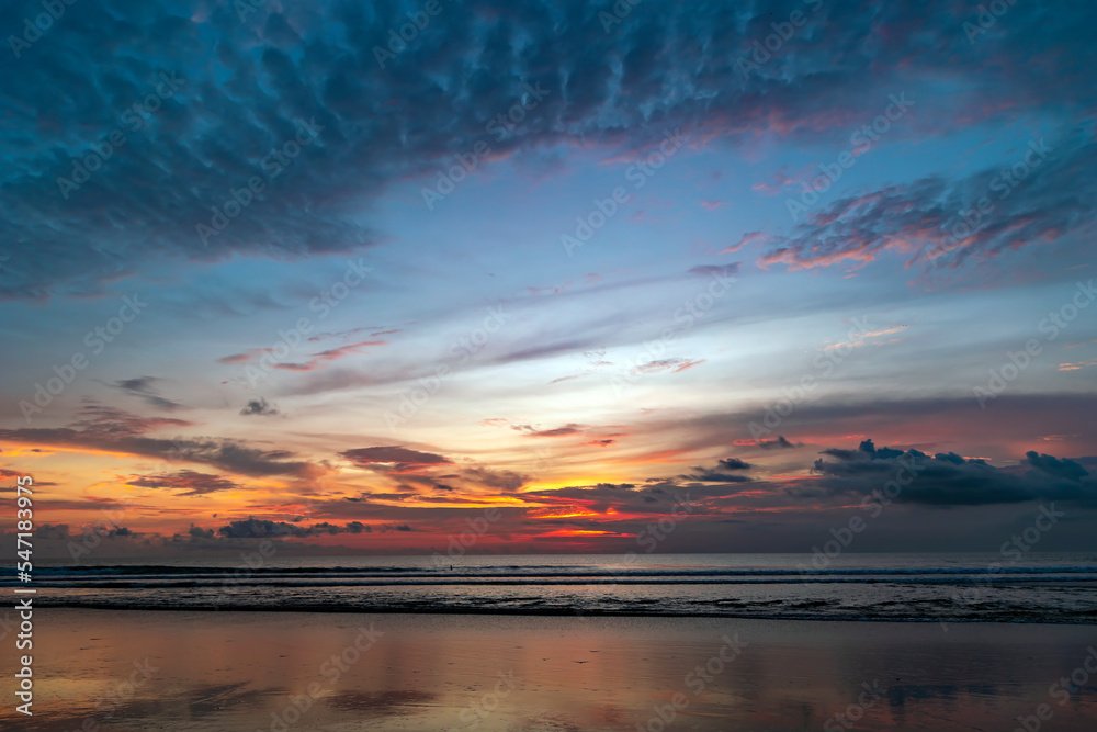 Beautiful colorful sunset over the Indian Ocean in Bali, Indonesia. Desktop wallpaper. Nature. Travel concept.	