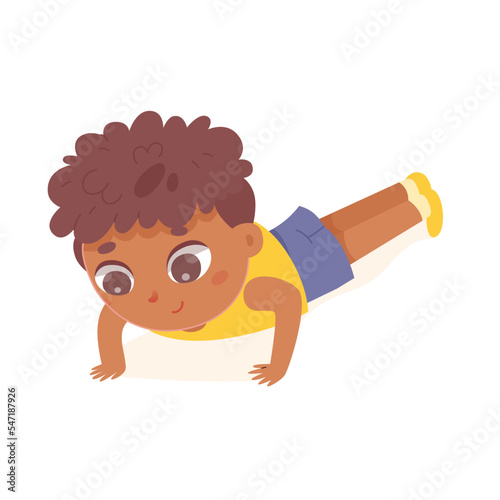 Boy doing push ups in gym, kid training strength of muscles of shoulders, chest and back