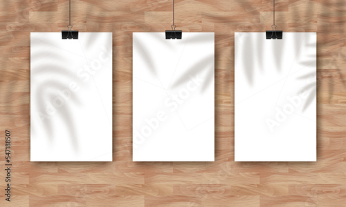 Vector Mockup with three empty white vertical posters on natural wooden background and palm shadow overlay. Trendy portfolio blanc space frame background for poster mock up, advertising, web portfolio
