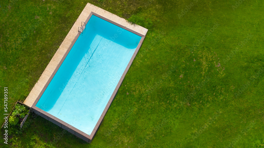 Aerial View Rectangular Inflatable Pool Aerial view of a rectangular swimming pool with diving board, belonging ...