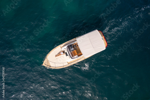 Drone top view of a little luxury boat sailing