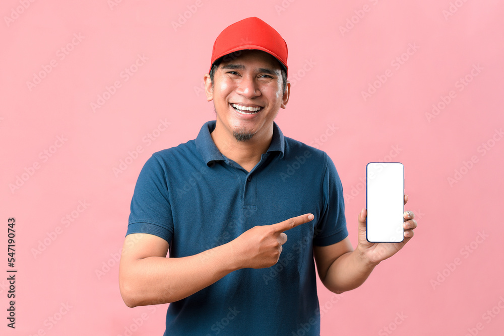 Portrait of Happy Asian delivery man showing phone screen and pointing at phone screen Portrait of Happy Asian delivery man showing phone screen and pointing at phone screen
