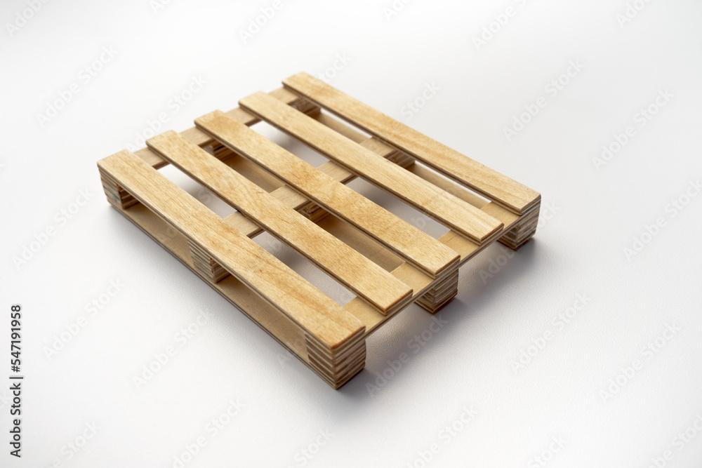 Wooden pallet made of wood on white isolate.Construction pallet on a white background. The stand is made of wood.