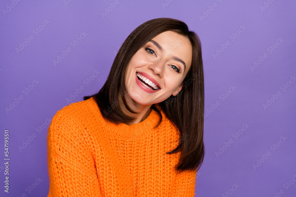 Photo of adorable lady beaming smile have good mood wear pullover isolated on violet color background Photo of adorable lady beaming smile have good mood wear pullover isolated on violet color background