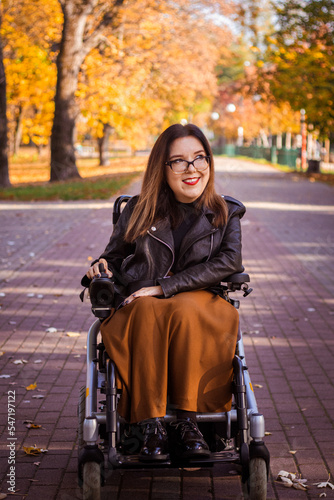 woman in a wheelchair in autumn nature.