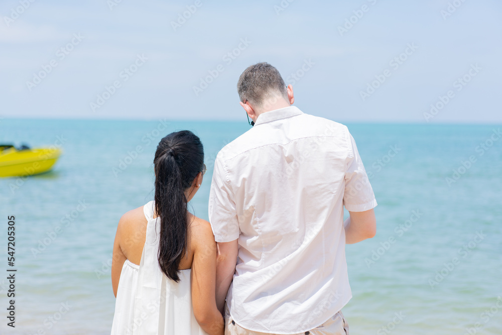 Romantic lovers young couple relaxing together on the tropical beach.Couple lover enjoy life.Summer vacations