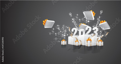 Happy 2023 New Year celebration with sparkle firework gold ribbons and white gift boxes on black background greeting card