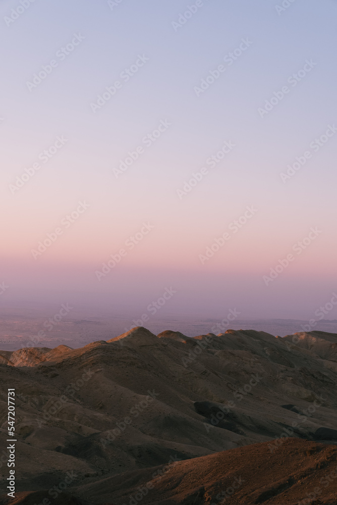 sunset over the mountains in jordan desert
