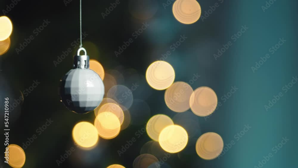 White Christmas ball floats in the air