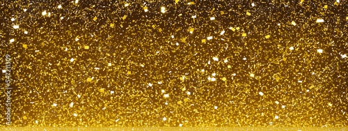 Confetti gold glitter shiny sparkle with luxury light glow on blur 3D. Happy New Year and Christmas holidays party celebration greeting card or beautiful wallpaper 8K