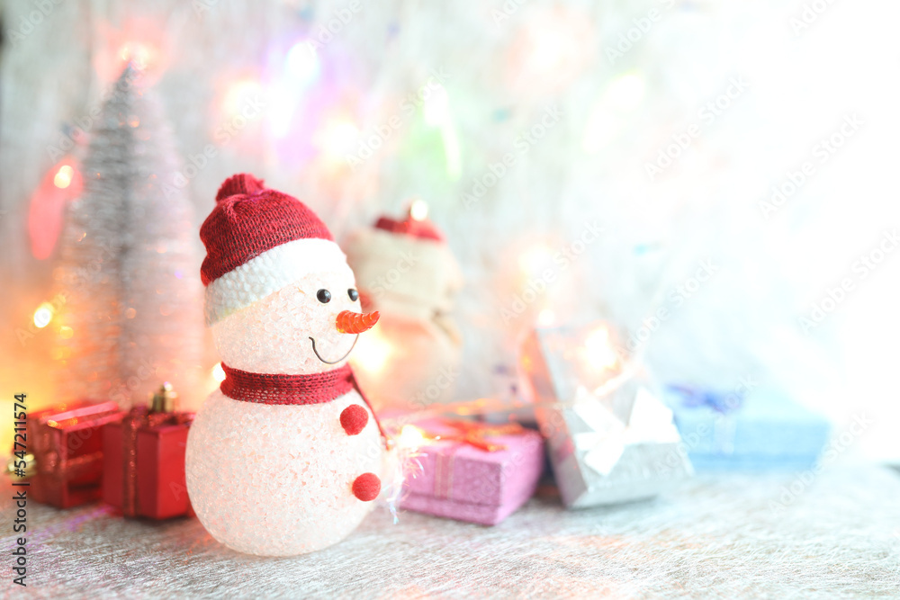 Snow man and Gift boxes and Christmas bright lights Snow man and Gift boxes and Christmas bright lights