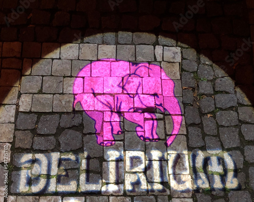 Pink elephant and the word Delirium