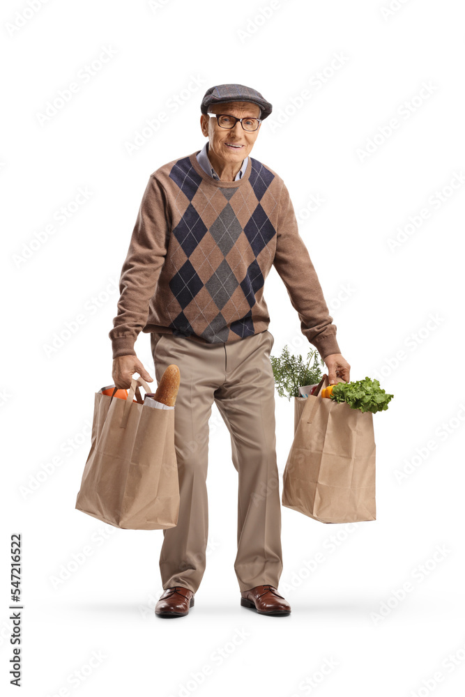 Tired elderly man carrying two grocery bags Stock Photo | Adobe Stock