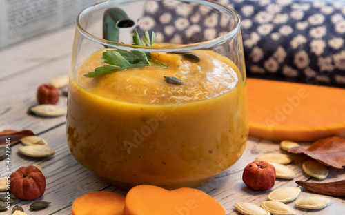 pumpkin and carrot cream soup with seeds, vegetarian food