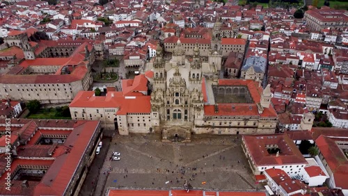 Cinematic aerial point of view of famous Cathedral of Santiago de Compostela. Drone backward and tilt up creating a beautiful panorama of the city. Travel destination in north of Spain Way of St James photo
