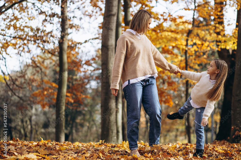 Mother with little daughter in autumn park Mother with little daughter in autumn park