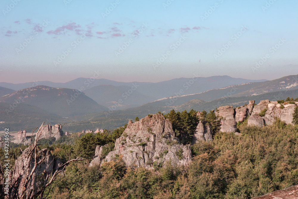 Stunning nature with high rocks and hills in Belogradchik in Bulgaria. Green nature and rocks in the wild with outstanding views.