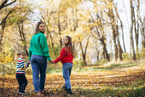 Mother with children walking in park