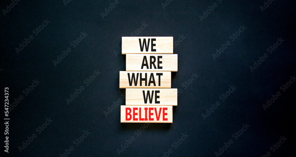 We are what we believe symbol. Concept words We are what we believe on wooden blocks. Beautiful black table black background. Business, motivational we are what we believe concept. Copy space. We are what we believe symbol. Concept words We are what we believe on wooden blocks. Beautiful black table black background. Business, motivational we are what we believe concept. Copy space.