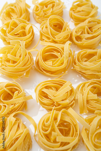 Close up of pasta uncooked tagliatelle italian food