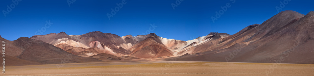 Panorama of The colourful Andes mountain range in the Salvador Dali Desert (Desierto de Salvador Dali) in the Altiplano region of Bolivia. 