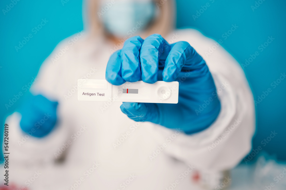 A laboratory employee taking sample PCR microtubes with cotton swab test. Diagnostic testing for COVID-19. The concept of the diagnosis of viral diseases. A laboratory employee taking sample PCR microtubes with cotton swab test. Diagnostic testing for COVID-19. The concept of the diagnosis of viral diseases.
