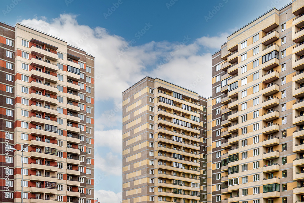 Fototapeta premium facade of brown block buildings in a residential complex