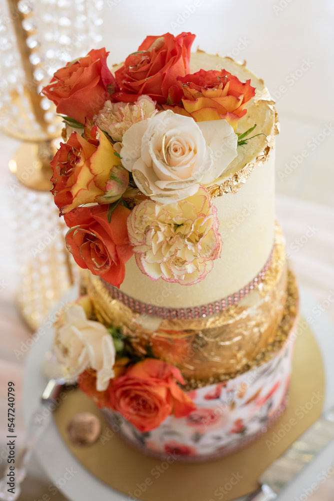 A flower arrangement at a wedding celebration A flower arrangement at a wedding celebration