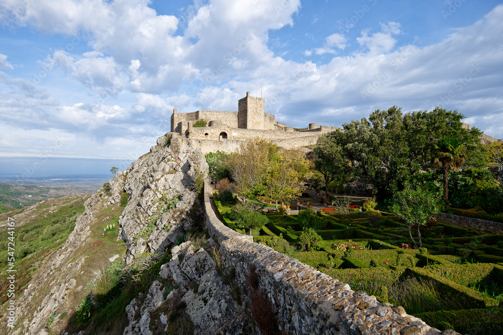 View of Marvao Castle during a sunny day with clouds. Historic Villages of Portugal. Old town inside of a fortified wall on the cliff of a mountain. Rural tourism. Holidays. Best destinations.