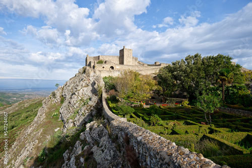 View of Marvao Castle during a sunny day with clouds. Historic Villages of Portugal. Old town inside of a fortified wall on the cliff of a mountain. Rural tourism. Holidays. Best destinations.