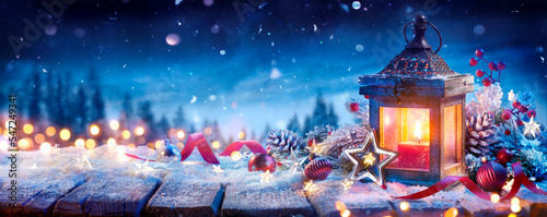 Obraz na plátně Christmas Lantern With Decoration On Snow Table - Snowy Candle Light And Abstrac