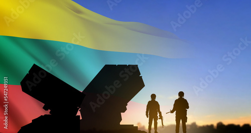 Anti-aircraft missile defense system on background at the sky at sunset with Lithuania flag. Air defence concept