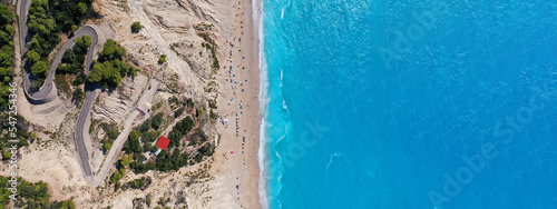 Aerial drone photo of famous paradise beach of Egremni white steep rocky hills overlooking deep turquoise Ionian sea, Lefkada island photo