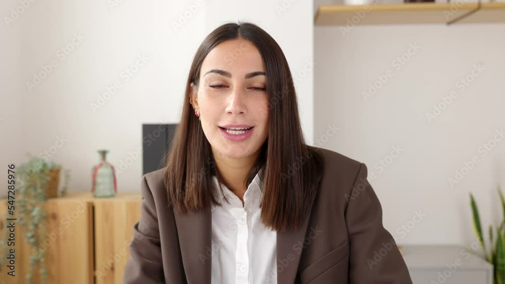 POV screen view of beautiful young business woman talking on laptop video call in the office. Smart entrepreneur female looking at camera having a conversation on virtual meeting. POV screen view of beautiful young business woman talking on laptop video call in the office. Smart entrepreneur female looking at camera having a conversation on virtual meeting.
