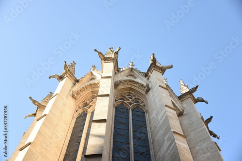 Low angle shot of Spinnerin am Kreuz monument in Vienna, Austria under a clear blue sky photo