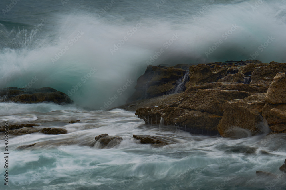 inspired haze. The brave ocean against the rocks. Waves inspired haze. The brave ocean against the rocks. Waves