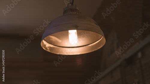 A low-hanging light in the dark