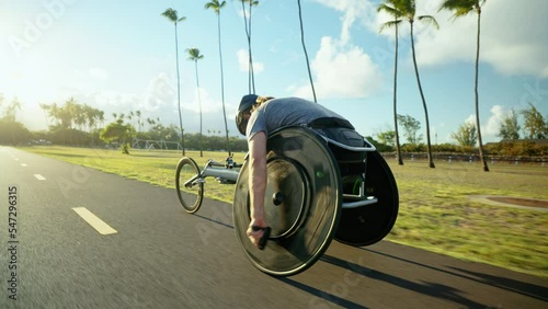 Disabled wheelchair paralympic athlete in wheelchair racing chair outside working out healthy lifestyle