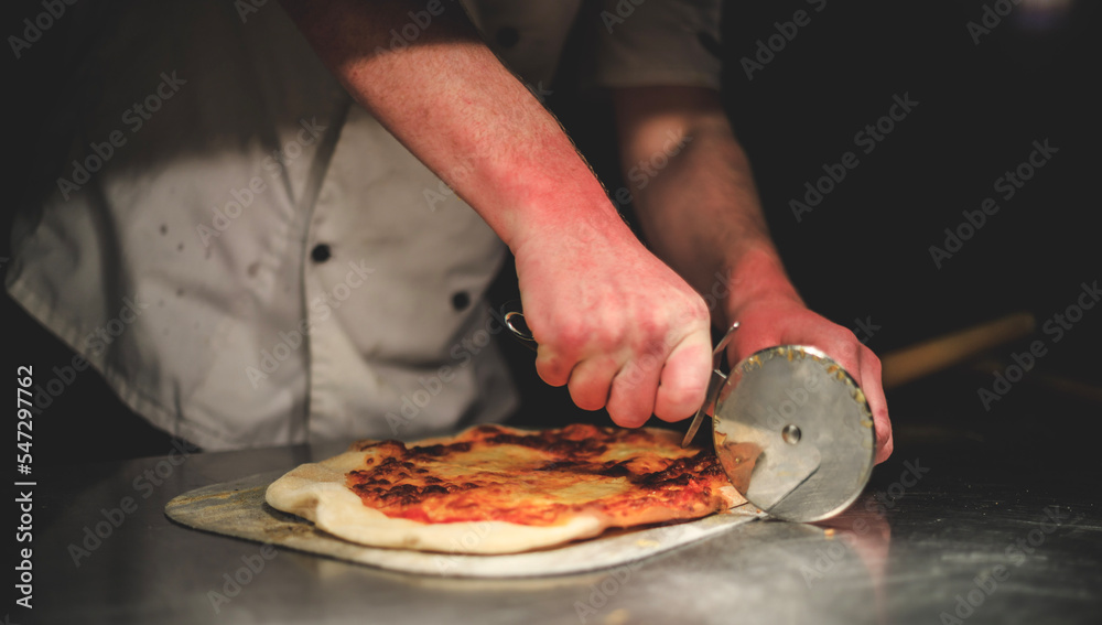 Pizza chef preparing pizza